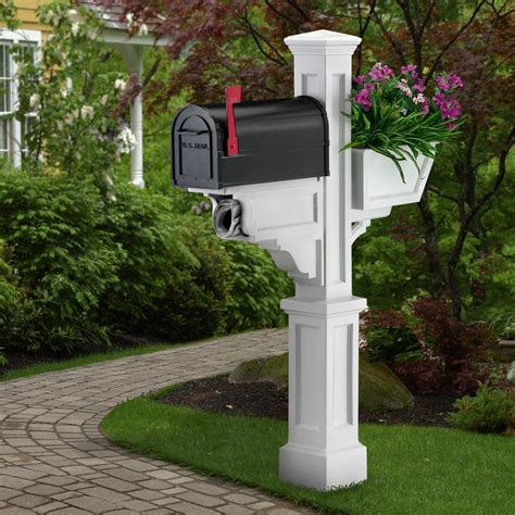 white residential mailboxes with posts